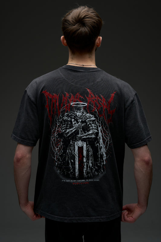 Model wearing the washed black Guts Dark Edition tee - back view with large armored warrior print