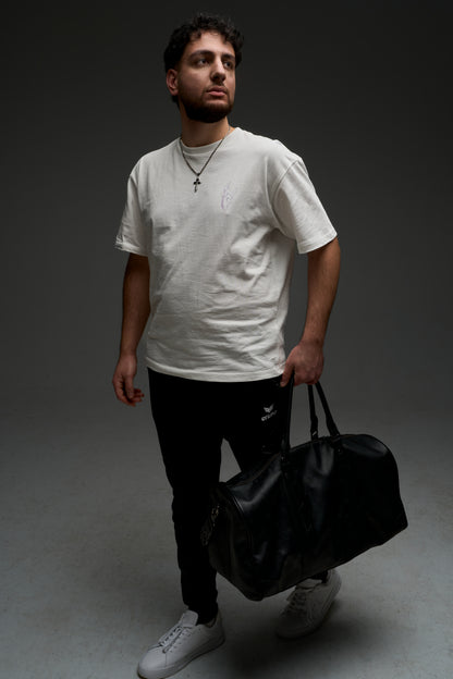 Model wearing the natural raw Hollow Purple armor tee - full body front view, oversized drop-shoulder fit