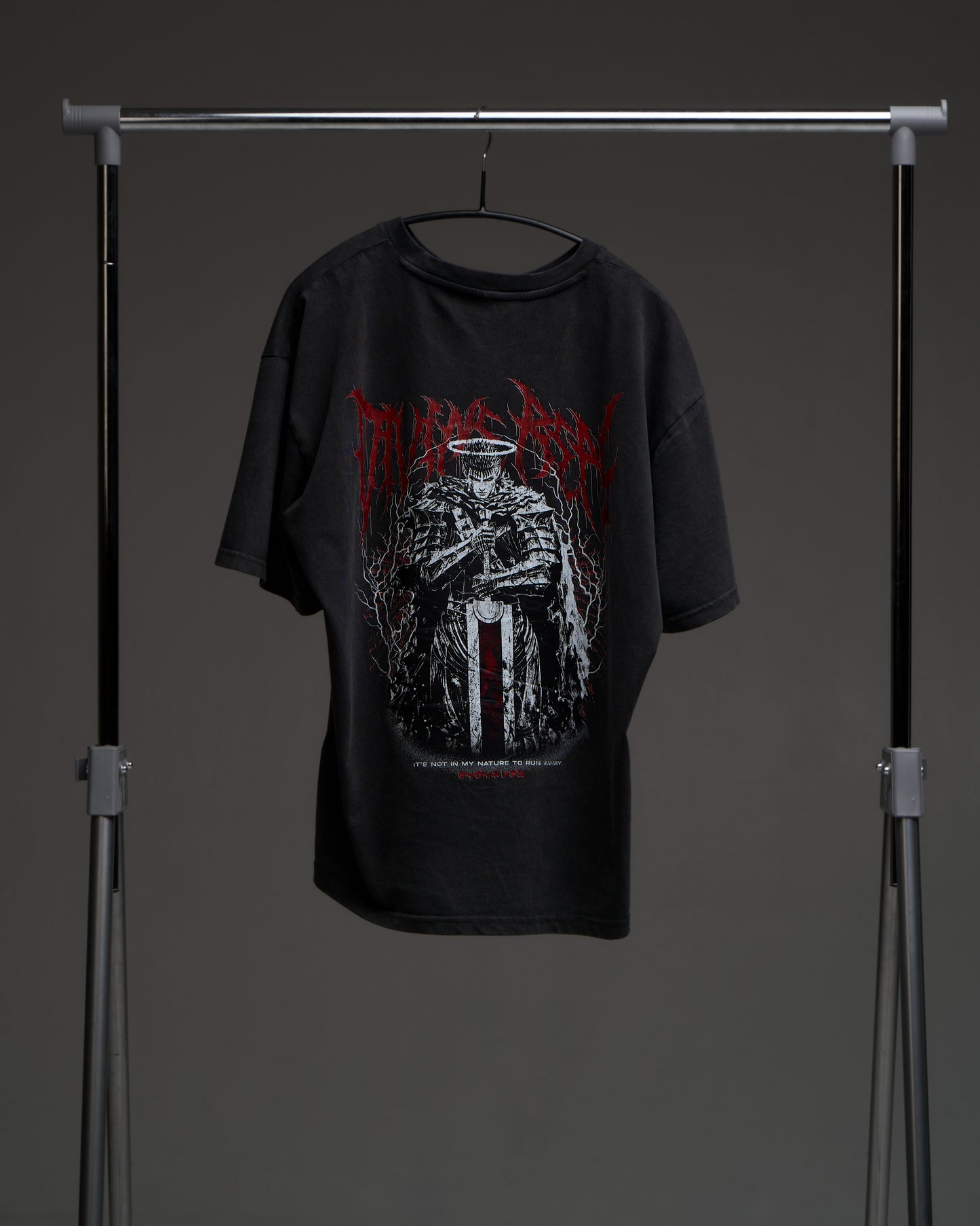 Washed black Guts Dark Edition tee on a rack - back view with large armored warrior print