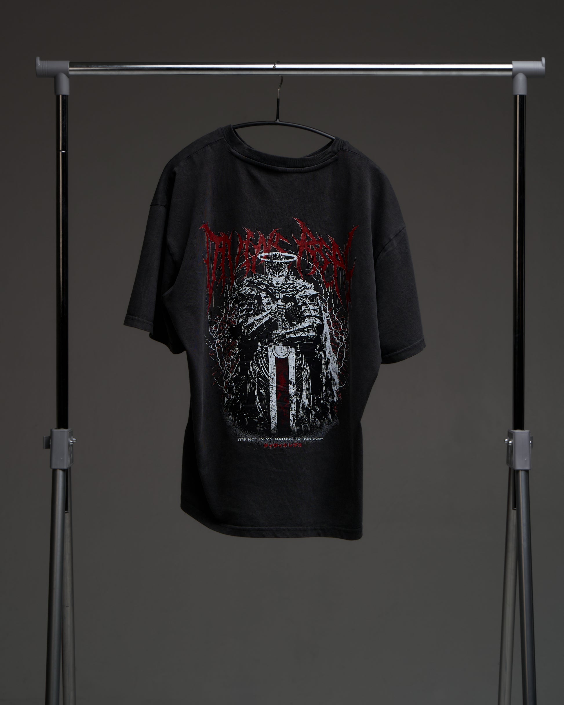 Washed black Guts Dark Edition tee on a rack - back view with large armored warrior print