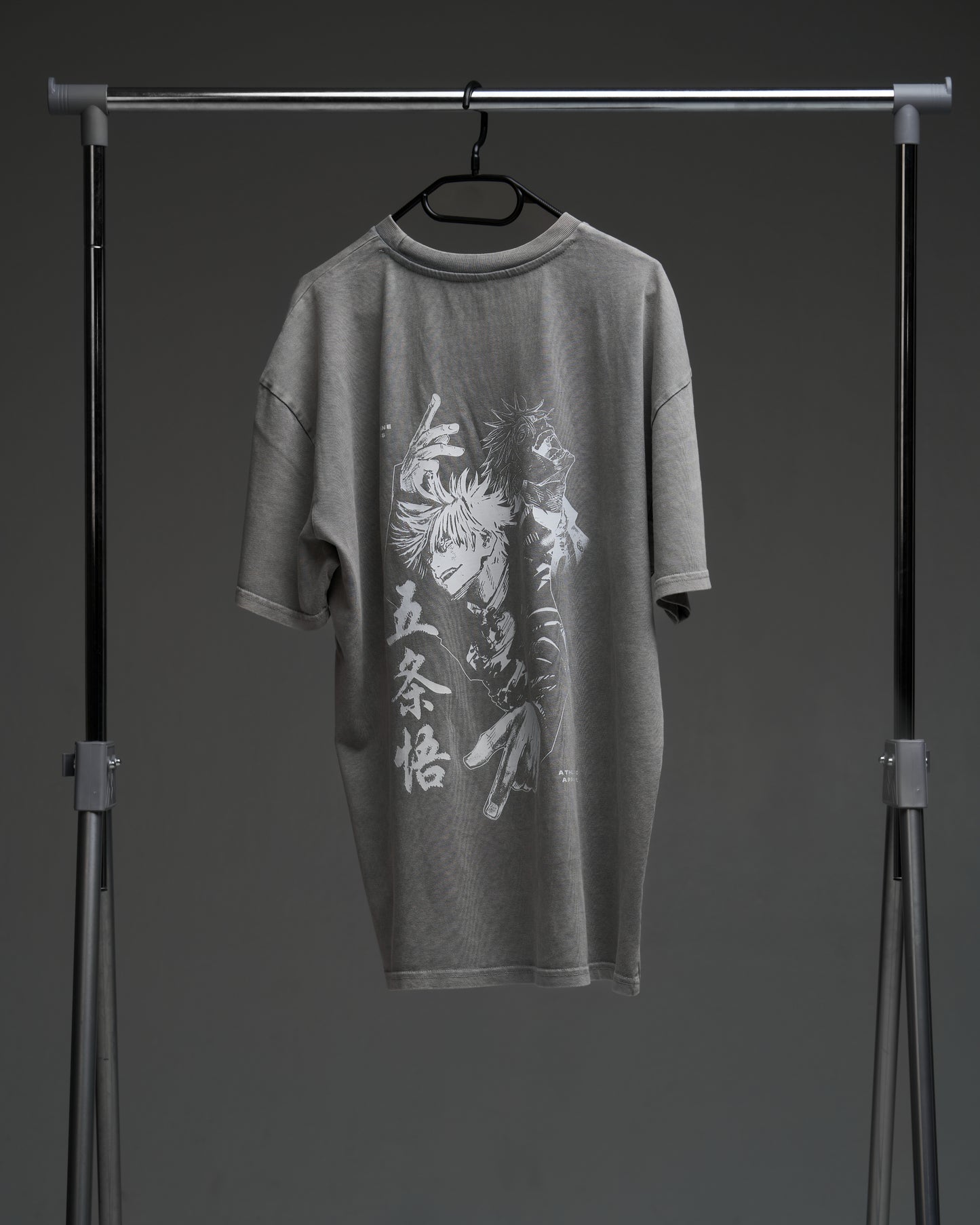 Washed grey Gojo armor tee on a rack - back view with large character print and kanji
