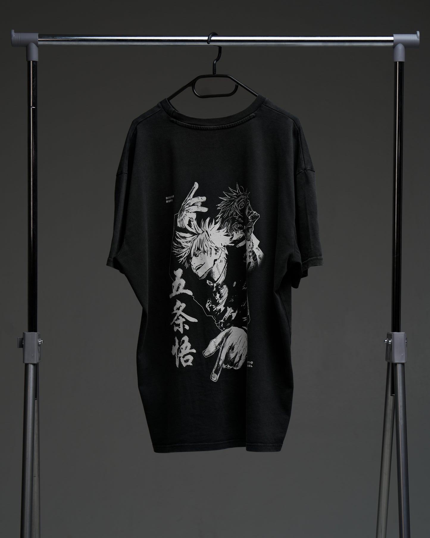 Black Gojo armor tee on a rack - back view with large monochrome character print and kanji